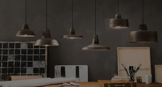 Pendant lights hanging over a workspace, from OzLighting