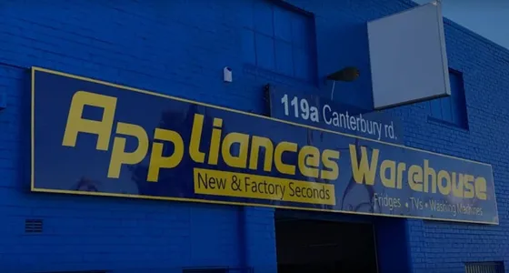 The blue Appliances Warehouse shopfront and street sign